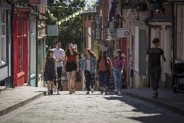 Students walking up steep hill