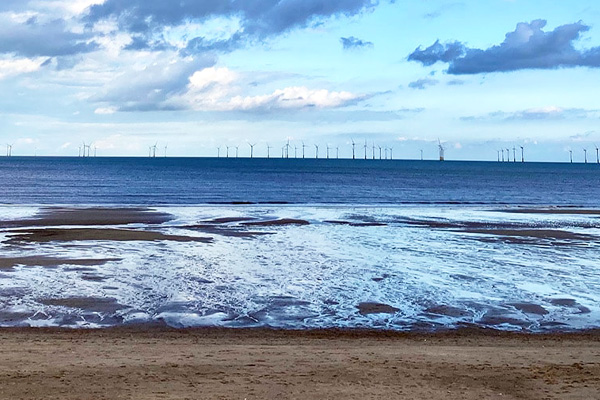 A coastline with wind turbines